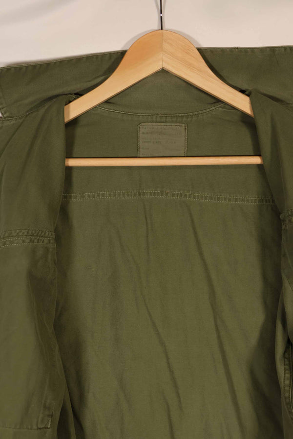 Real 1970 Australian Army OD Fatigue shirt with rank insignia, size unreadable.