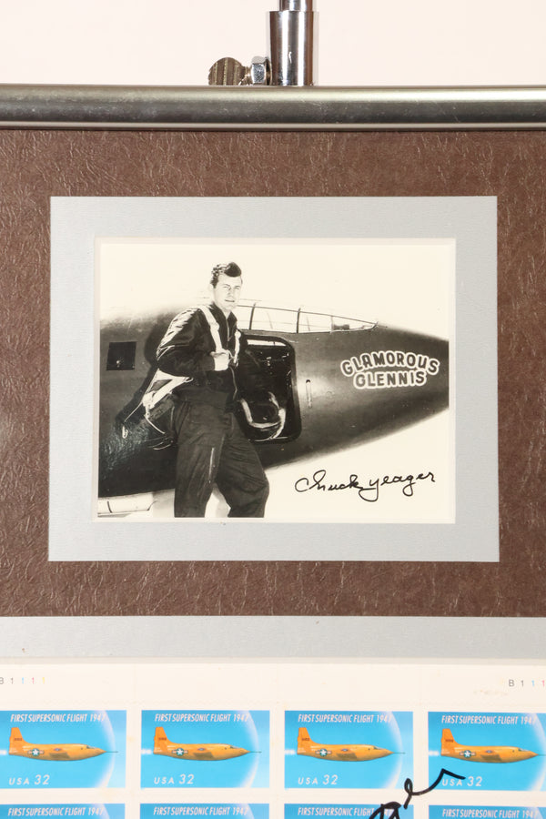 Framed photo and stamp autographed by Air Force Brigadier General Chuck Yeager, commemorating the 50th anniversary of breaking the sound barrier.