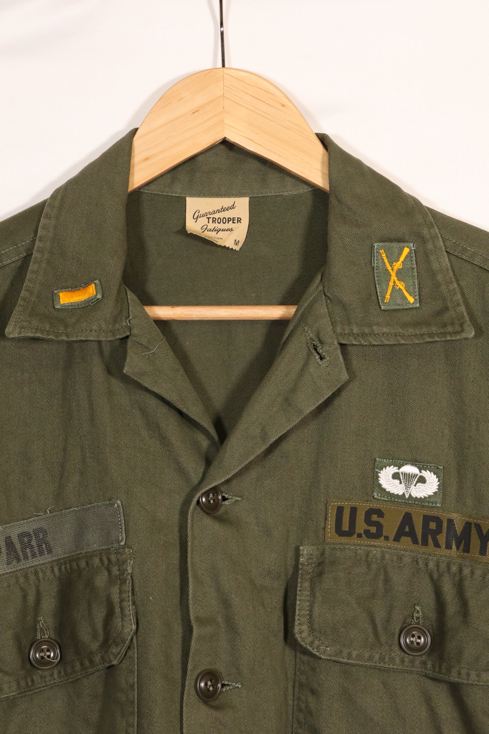 1960s-70s OG-107 utility shirt, Army paratrooper, patch first attached, used.