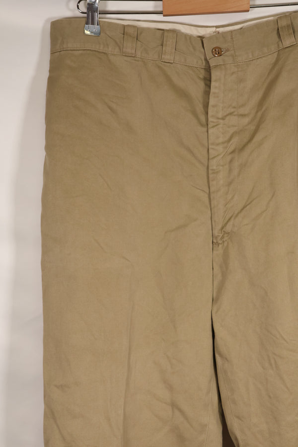 1960s, estimated 34-36 US Army cotton khaki pants, used.