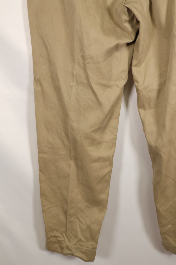 1960s, estimated 34-36 US Army cotton khaki pants, used.
