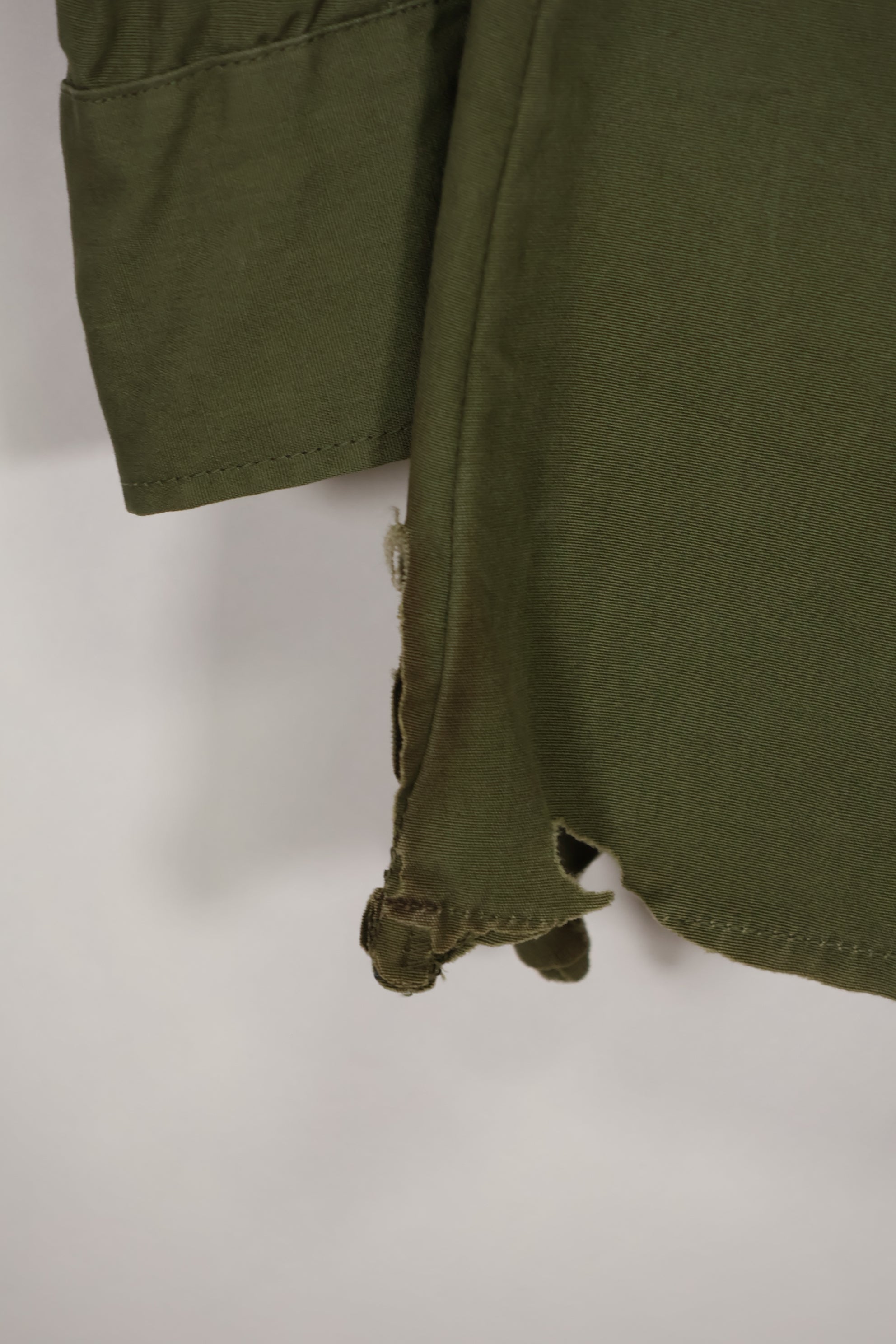 Real 1966-1967 3rd Model Jungle Fatigue Jacket L-R with damage.