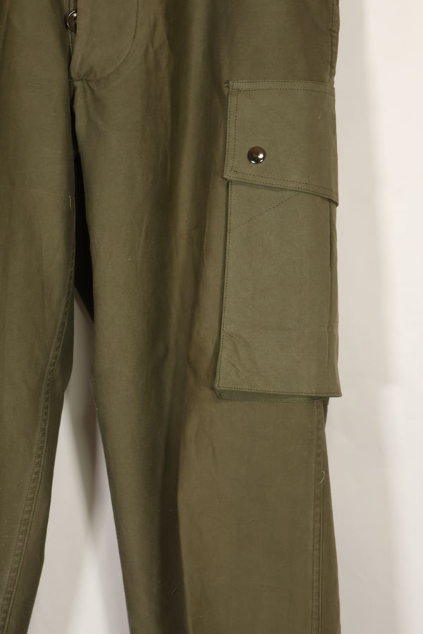 Real U.S. Army M45 pants with additional pocket modification, used.