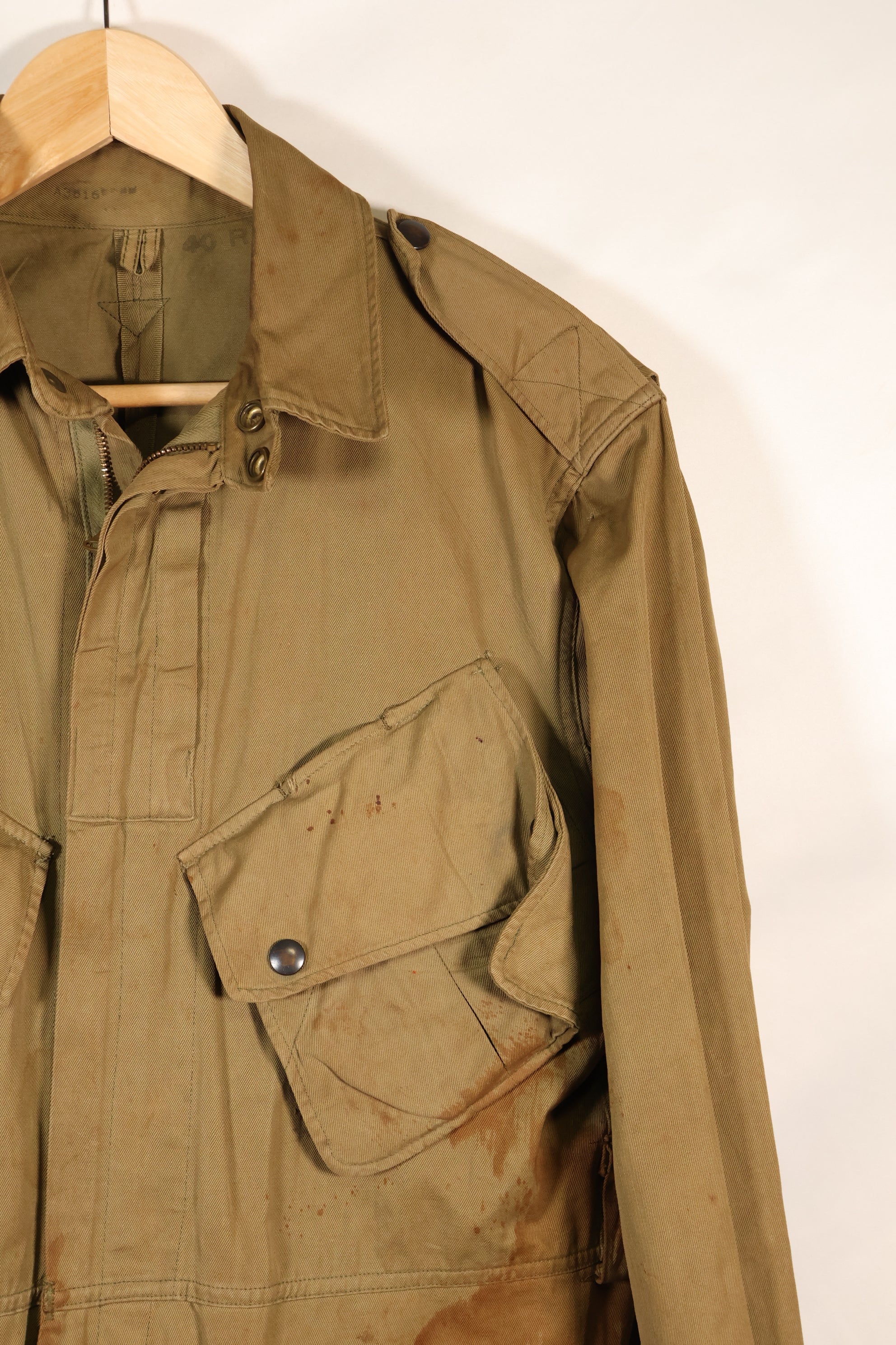 1940s 40R WWII M42 jump jacket without waist belt, stained, used.