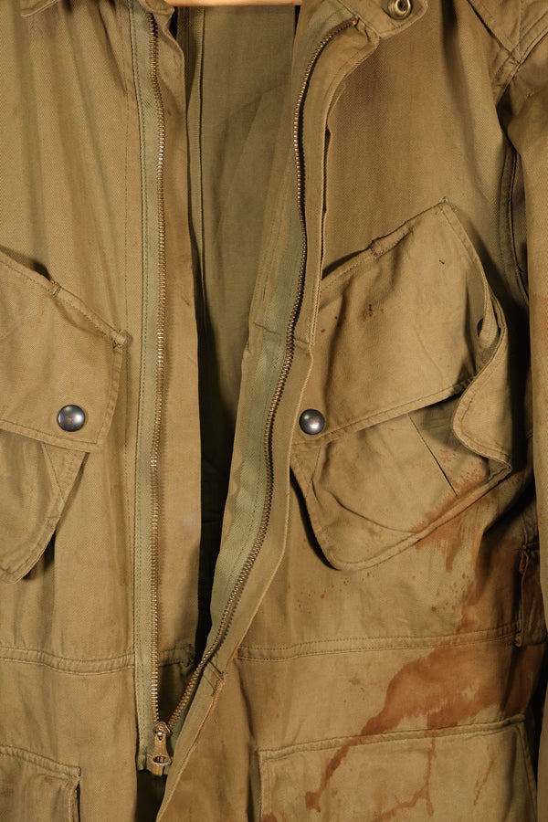 1940s 40R WWII M42 jump jacket without waist belt, stained, used.