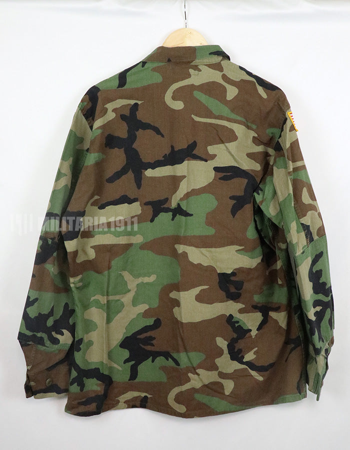 Original U.S. Army Woodland Camouflage Jacket with patches, 1990.