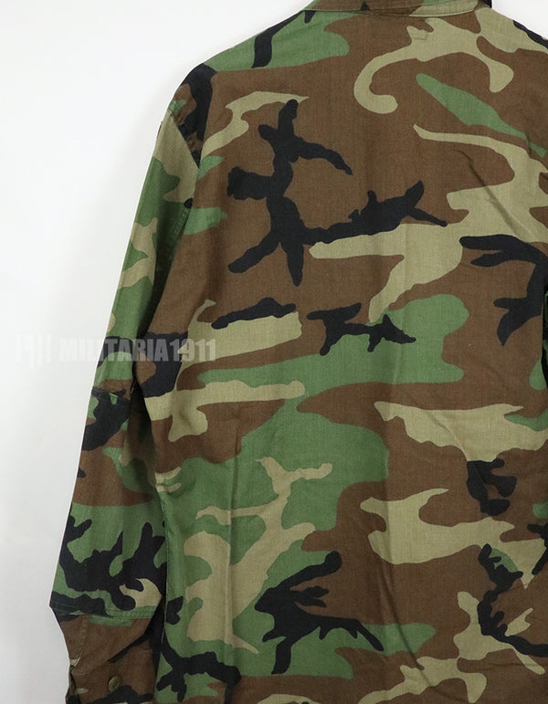 Original U.S. Army Woodland Camouflage Jacket with patches, 1990.