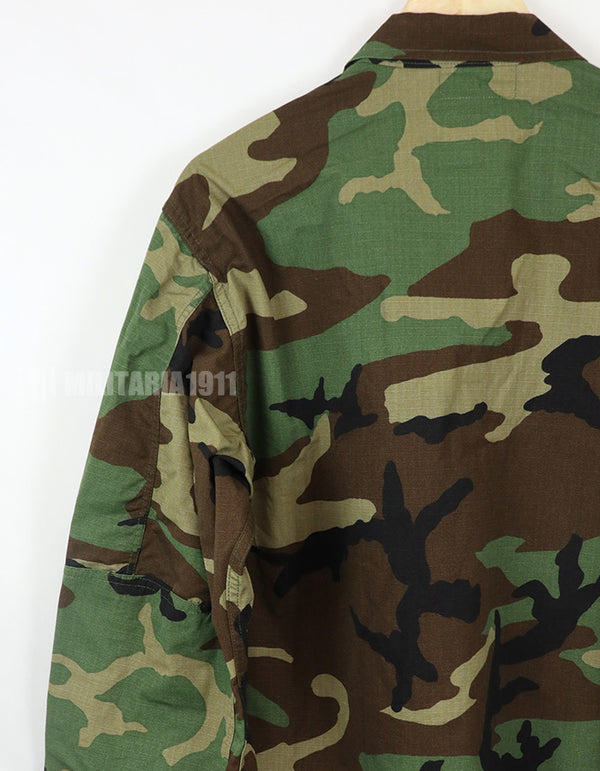 Real U.S. Army Woodland Camouflage Jacket, 2000, with patches.