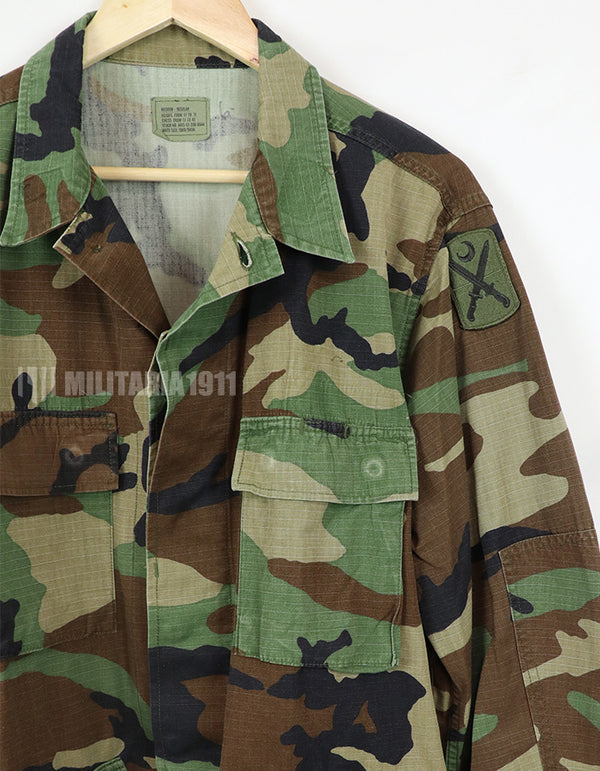 Real U.S. Army Woodland Camouflage Jacket, 2007, with patches.