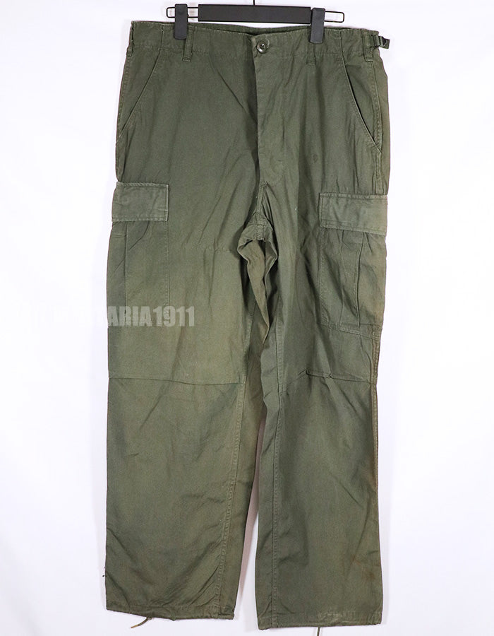 Real 1967 poplin fabric jungle fatigues pants, used, repaired.