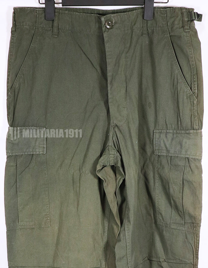 Real 1967 poplin fabric jungle fatigues pants, used, repaired.