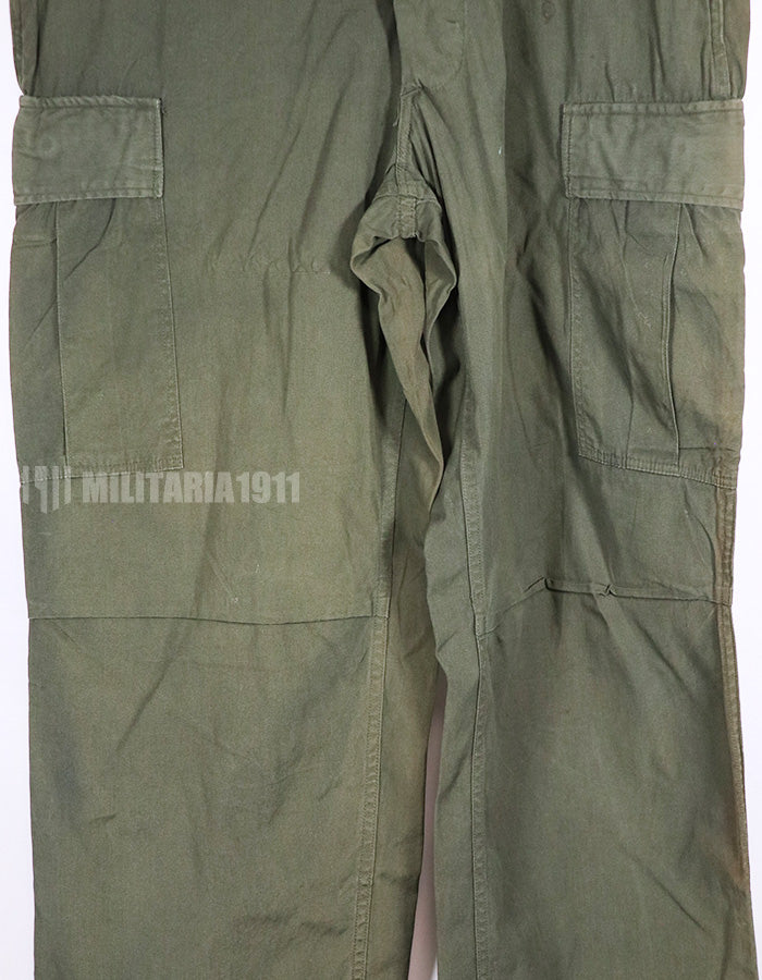 Real 1967 poplin fabric jungle fatigues pants, used, repaired.