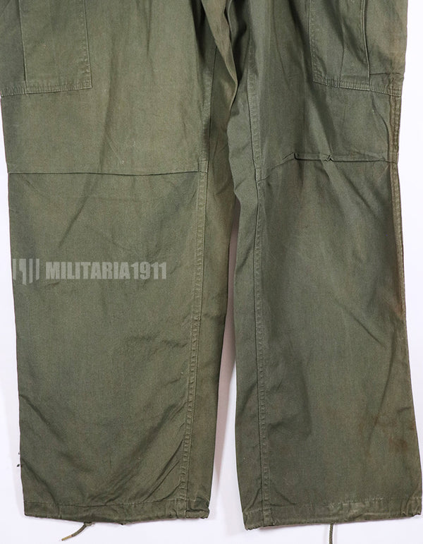 Real 1967 poplin fabric jungle fatigues pants, used, repaired.