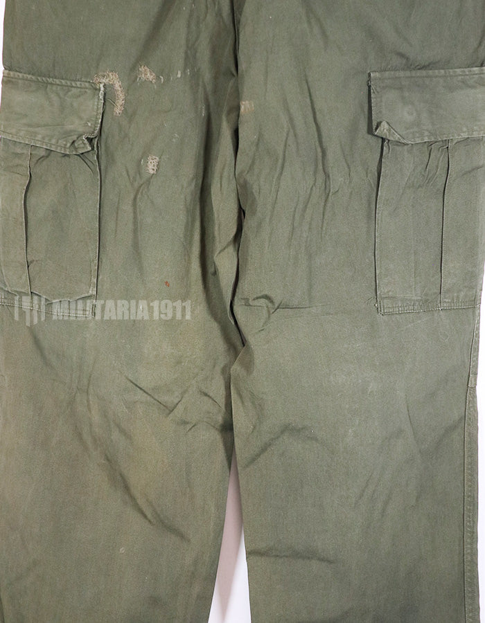 Real 1967 poplin fabric jungle fatigues pants, used, repaired.