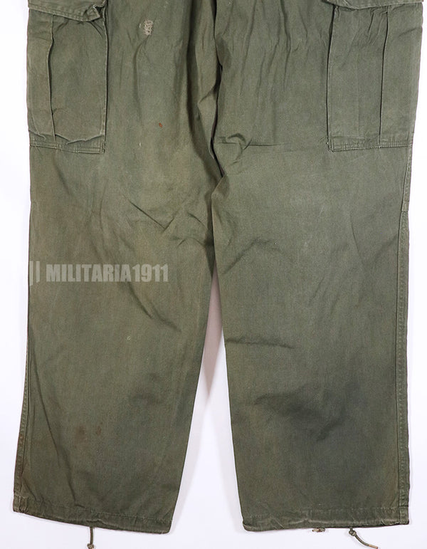 Real 1967 poplin fabric jungle fatigues pants, used, repaired.