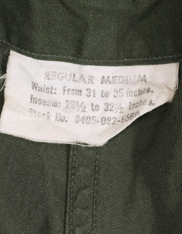 Real 1967 poplin fabric jungle fatigues pants, used, repaired.